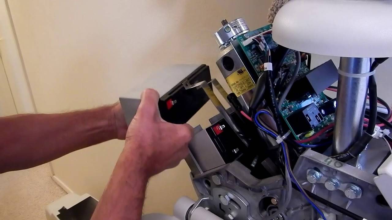 A set of hands performing a Bruno Stairlift Repair in Glen Burnie, MD