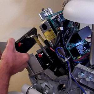 man in the middle of a Acorn Stairlift Repair in Arlington