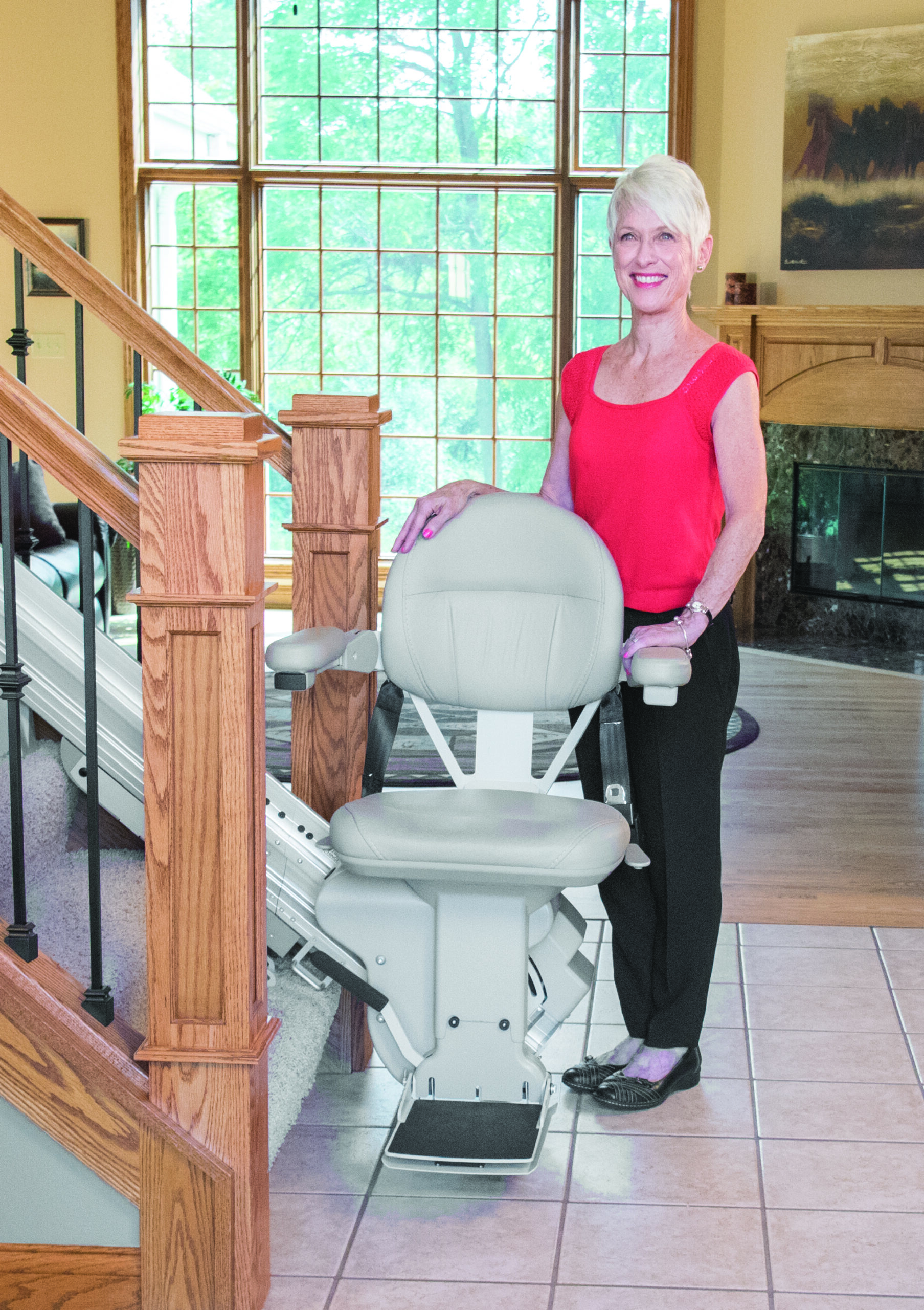 woman standing next to newly installed stairlift in Germantown