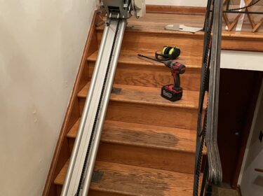 Stairlift maintenance on a stairlift rail in Baltimore, MD