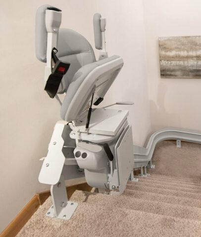 Stairlift Service with a chair at the base in Hagerstown,MD