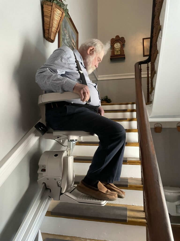 man using Pre-Owned Stairlift after Installation in Silver Spring, Maryland